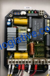 Close-up of an electrical control board with capacitors, a yellow transformer, copper coil, and multiple wiring harnesses inside a metal enclosure.